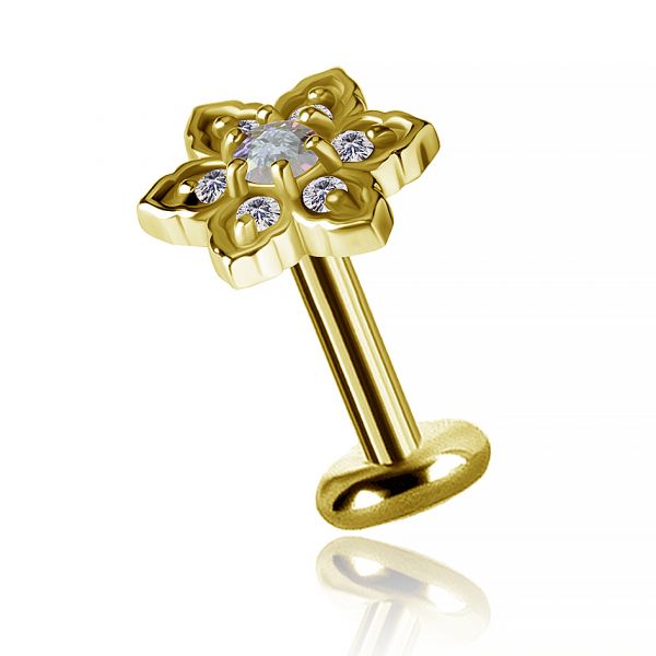 Golden tragus piercing with little flower
