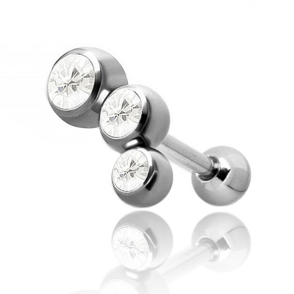 Tragus piercing with three small crystals