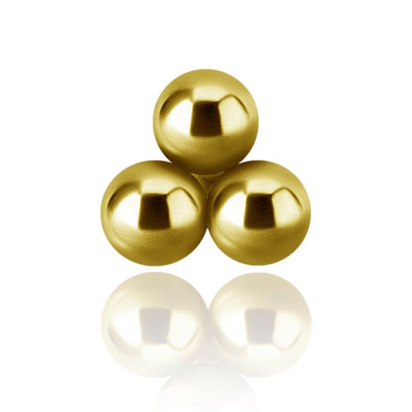 Golden labret piercing with trinity of spheres