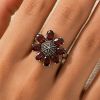 SILVER RING WITH A GARNET FLOWER