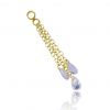 Golden charm with chains and zirconia crystals