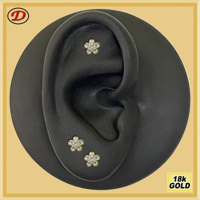 GOLD PIERCING WITH FLOWER-SHAPED JEWEL